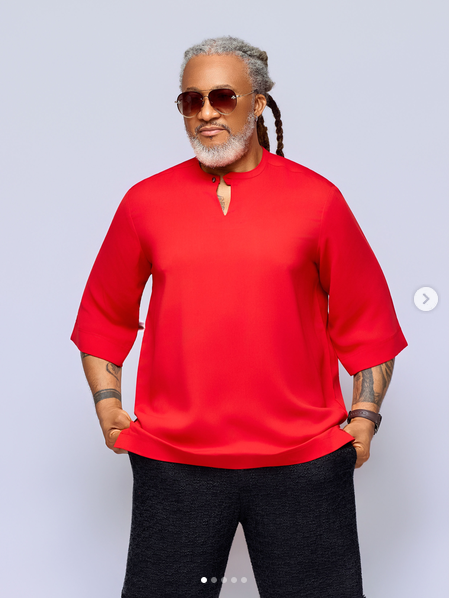 TNH model wearing a vivid red relaxed-fit top